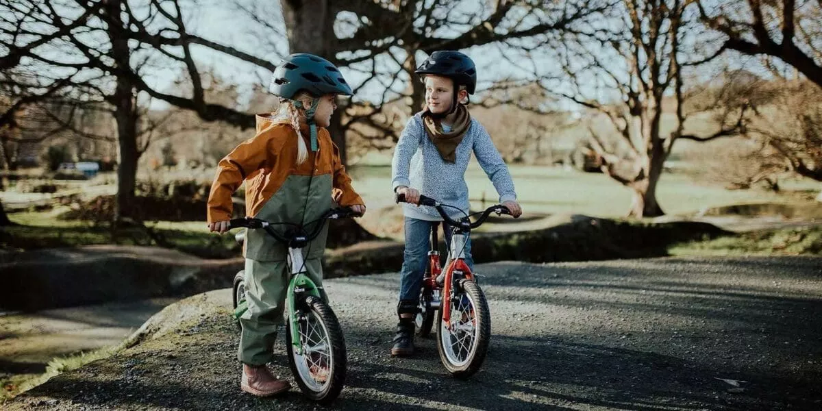 2 kids on littlebig convertible balance bike