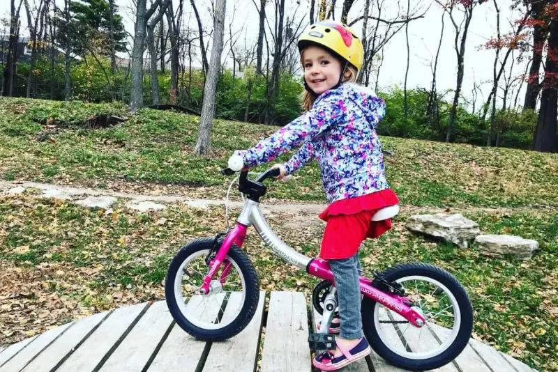 girl on pink littlebig bike